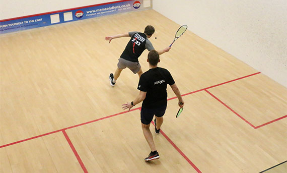 Two male players on court